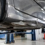 Bas de caisse enfoncé : causes, réparation et coût des travaux